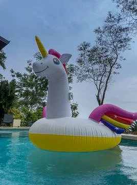 Giant Inflatable Unicorn Pool Float Floatie Ride Stock Photos