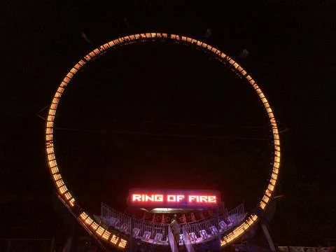Giant loop ride at fairgrounds at night Stock Photos