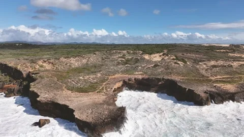 Giant ocean waves crash against the steep cliff along Fishermens Trail, Portugal Stock Footage 289743530