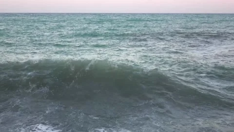 Giant ocean waves fall on the shore. Storm in the city Stock Footage 130876035