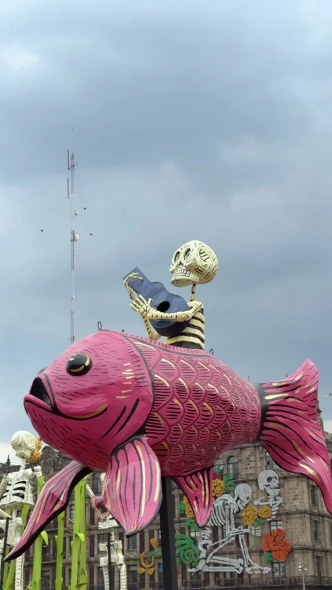 Giant paper skeleton mounted on fish. Day of the dead celebration. Zocalo, CDMX Stock Footage 291574020