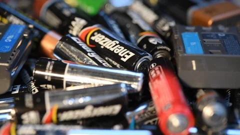 Giant pile of aa and aaa batterys for recycling Stock Footage 100819082