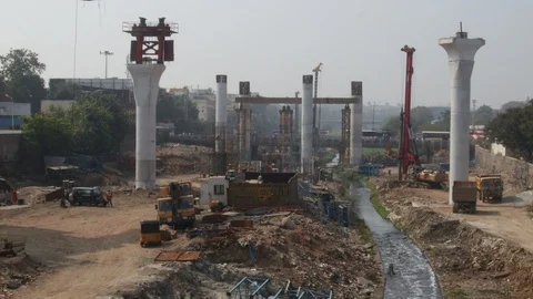 Giant pillars on riverbed metro rail construction Stock Footage 106060080