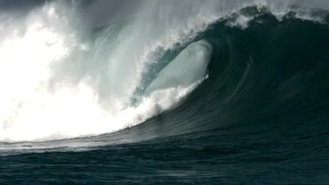 Giant powerful ocean wave breaking with intense white foam Stock Footage 339131917