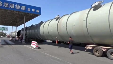 Giant road-train carrying a pipe Stock Footage 130417775