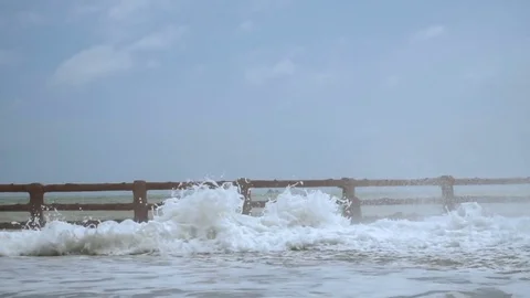 Giant Sea Waves Fall on Waterfront. Reversed Video stock 83168645