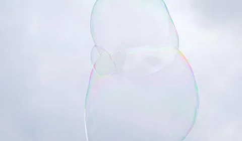 Giant soap bubbles explode at the touch of children's hands 写真素材