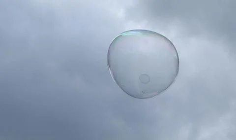 Giant soap bubbles explode at the touch of children's hands Stock Photos