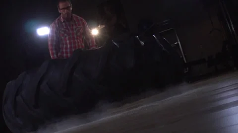 Giant Tire Falling In Dust Slow Motion.mp4 Stock Footage