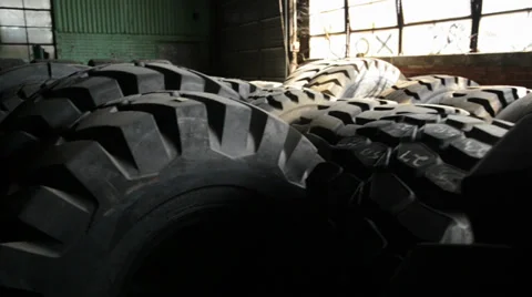 Giant Tires in Warehouse Stock Footage 32143878