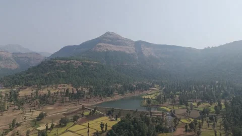 Giant view of mountain with small lake and farm land. Stock Footage 255280719