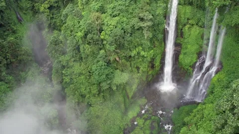 Giant waterfall, rainforest and low cloud in Bali, Indonesia Stock Footage 220114305