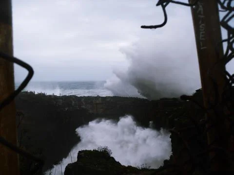 Giant wave breaking on the shore Stock Photos