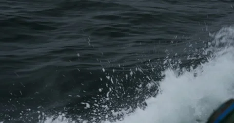 Giant waves created by ship roll across vast gray sea Stock Footage 321774668