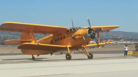 Giant Yellow Biplane turns engine Stock Footage 31238906