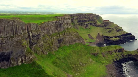 Giant's Causeway featuring Basalt columns foreground Northern Ireland Stock Footage 338332587