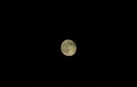 Gibbous moon on dark sky 스톡 사진