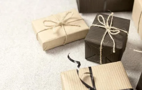 Gift black and brown boxes on white textures surface. Top view. Stock Photos