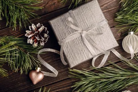 Gift with bow and Christmas decorations Stock Photos