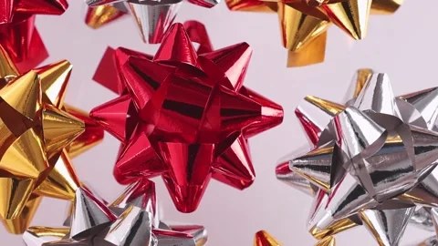 Gift bows of red and yellow color rotate top view. Stock Footage 170699642