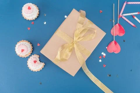Gift box and cakes Stock Photos