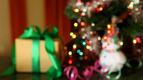 Gift box and christmas tree with snowman, from blur to sharp 스톡 동영상 81829474