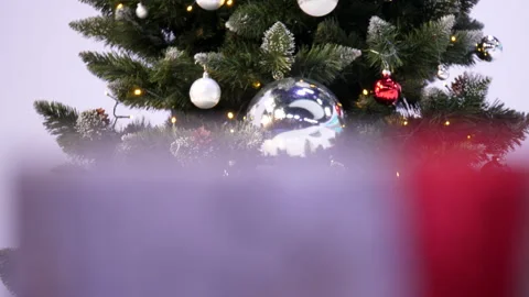 Gift Box and Christmas Tree With Decoration. Focus Change. Stock Footage 219380683