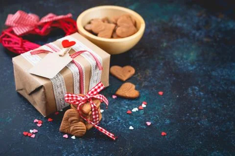 Gift box with and cookies in the shape of heart. Stock Photos