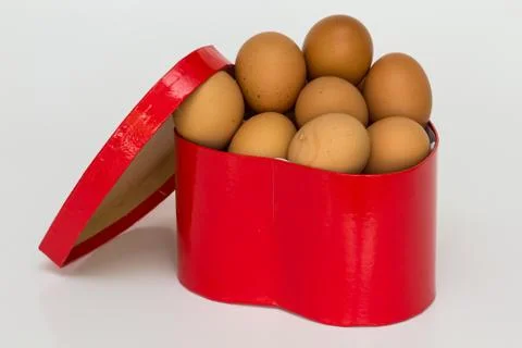 Gift box and egg Stock Photos