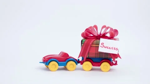 Gift box and note success delivered by toy car Stock Footage 152930220