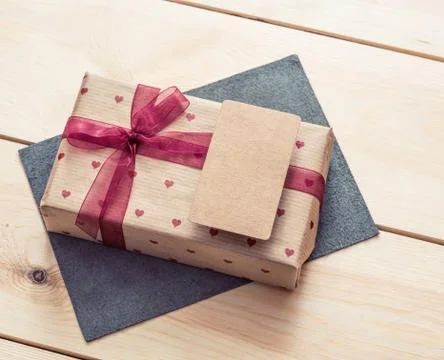 Gift box with blank tag Stock Photos