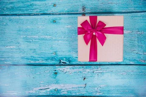 Gift Box on Blue Background Stock Photos