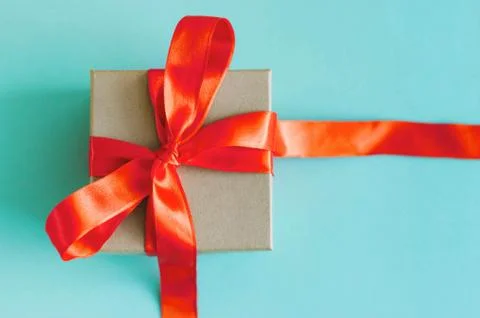 Gift box on blue background. Stock Photos