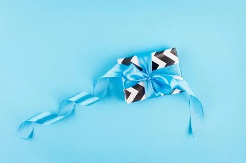 Gift box on a blue background Stock Photos