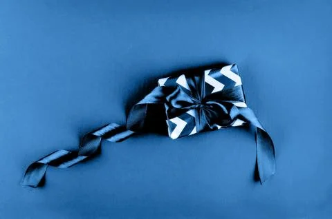 Gift box on a blue background Photos