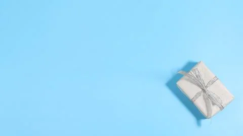 Gift box on blue background Stock-Fotos