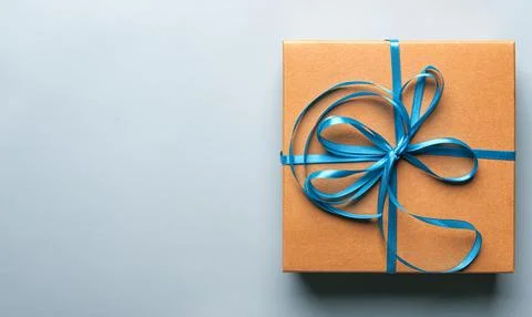 Gift box on a blue background. Stock Photos