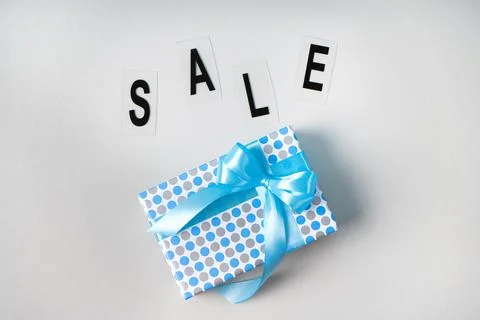 Gift box with a bright bow and the inscription SALE..Black Friday composition Stock-Fotos