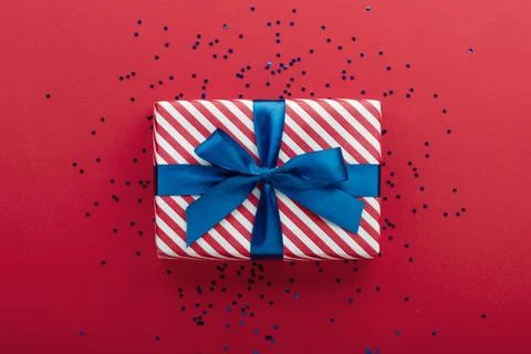 Gift box on color background, flat lay, space for text Stock Photos