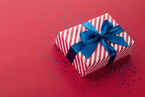 Gift box on color background, flat lay, space for text Stock Photos