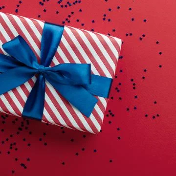 Gift box on color background, flat lay, space for text Stock Photos