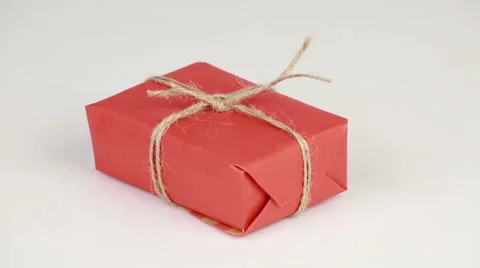 Gift box covered with red wrapping paper Stock Footage 58673520