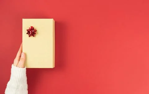 Gift box with decorations on a red background. Valentine's Day, anniversary, Stock Photos