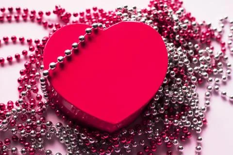 Gift box on the festive background. Red heart. Valentine's Day gift. Stock Photos