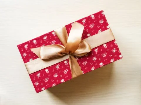 Gift box on the floor Stock Photos