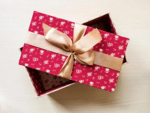 Gift box on the floor Stock Photos