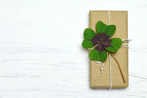 Gift box  with four leaf clover Stock Photos