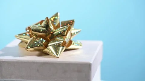 Gift box with golden bow Video stock 320256390
