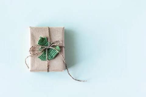 Gift box in gray craft paper Stock Photos