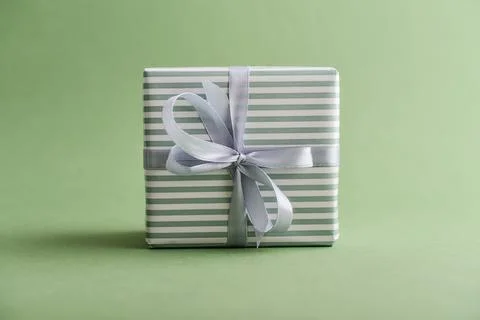 Gift box with gray ribbon Stock Photos
